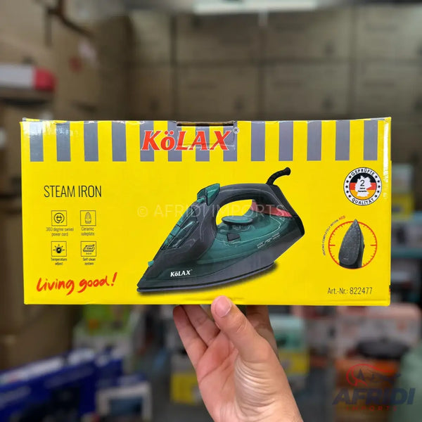 Kolax steam iron in a yellow box with product features.