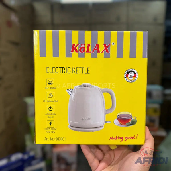 A packaged electric kettle with features like 360-degree rotation, stainless steel construction, automatic shut-off, and specific power ratings.