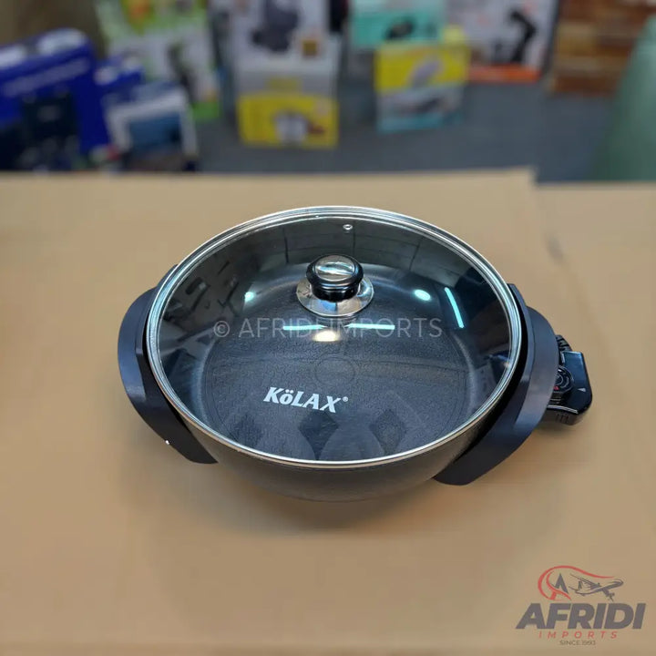 Black electric skillet with a glass lid