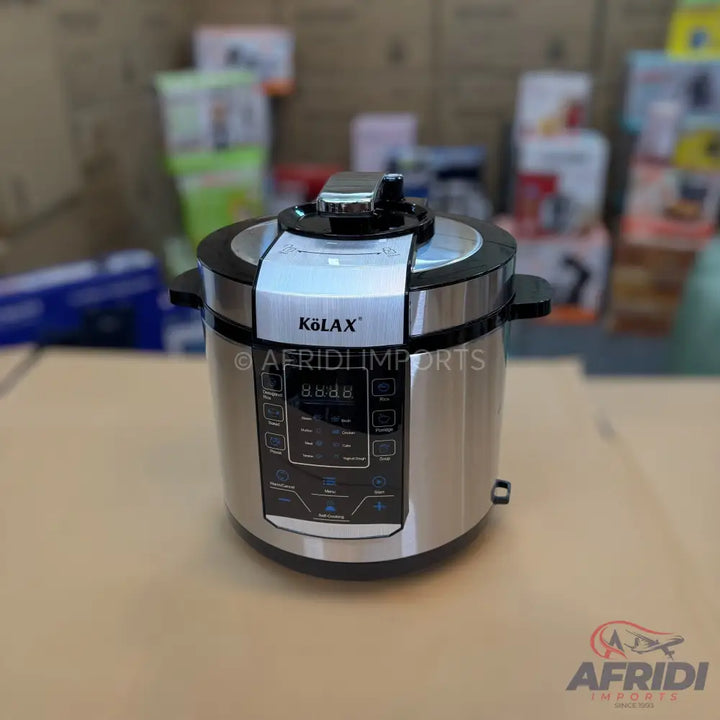 Silver and black electric pressure cooker with a digital control panel.