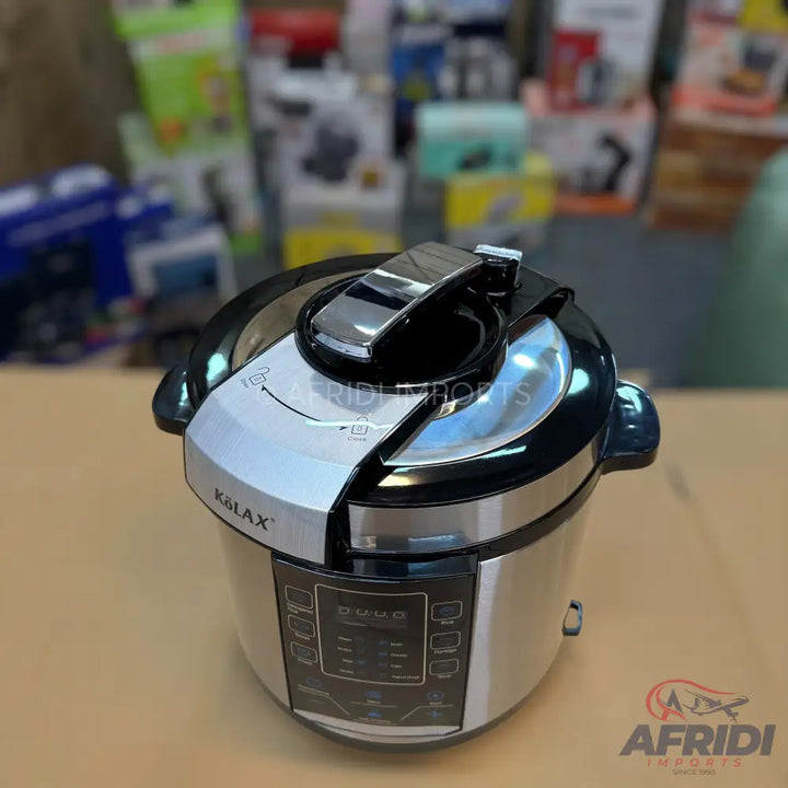 Silver and black electric pressure cooker with a digital display and top handle.