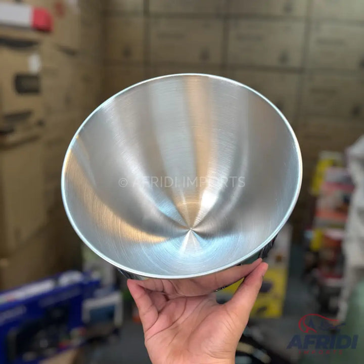 A brushed metal, conical mixing bowl.