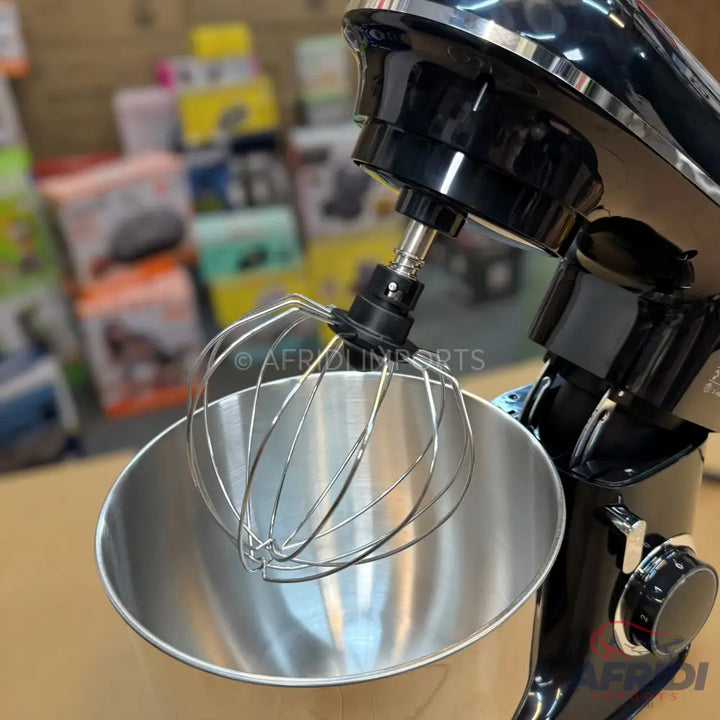 Black stand mixer with a stainless steel whisk and mixing bowl.