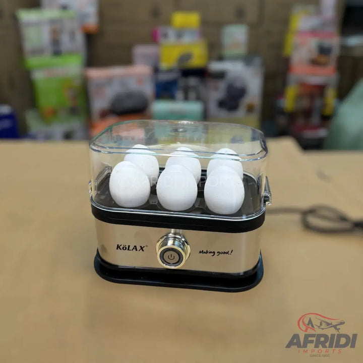 Stainless steel egg cooker with a transparent lid, capable of steaming six eggs at once.