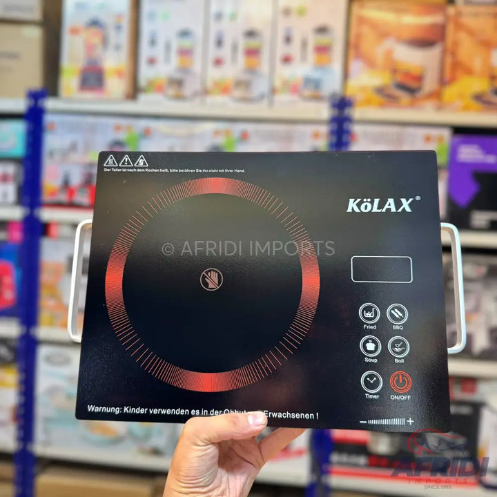 A portable black induction cooktop with digital controls.