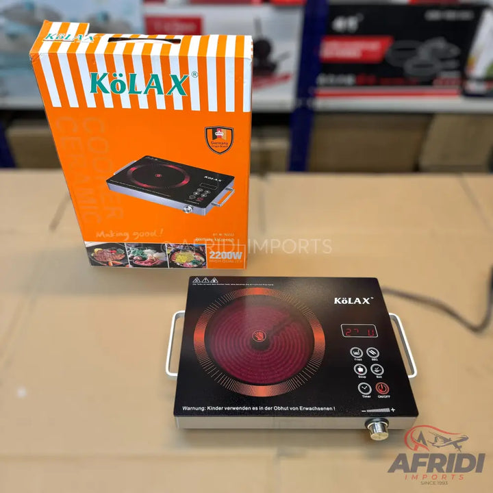 A KÖLAX 2200W single-burner electric induction cooktop with digital controls and a rotary knob.
