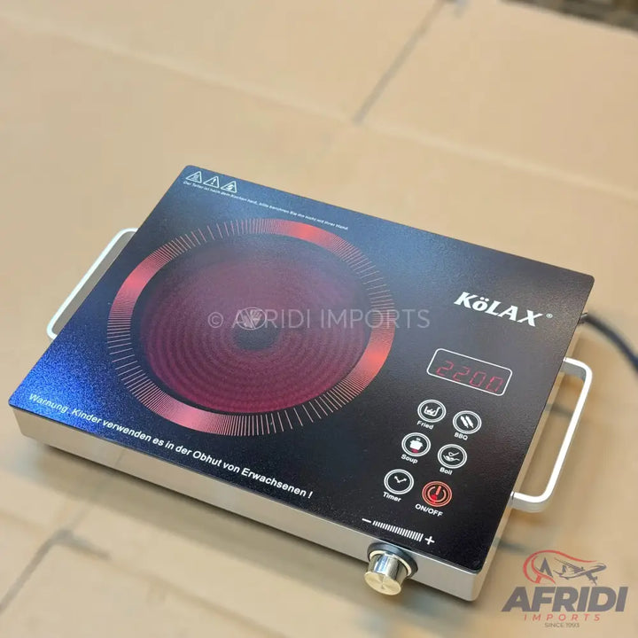 Black induction cooktop with a single burner and digital controls.