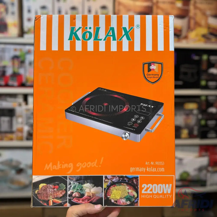 Orange and white box for an induction cooktop with food images and ’2200W HIGH QUALITY’ specifications.