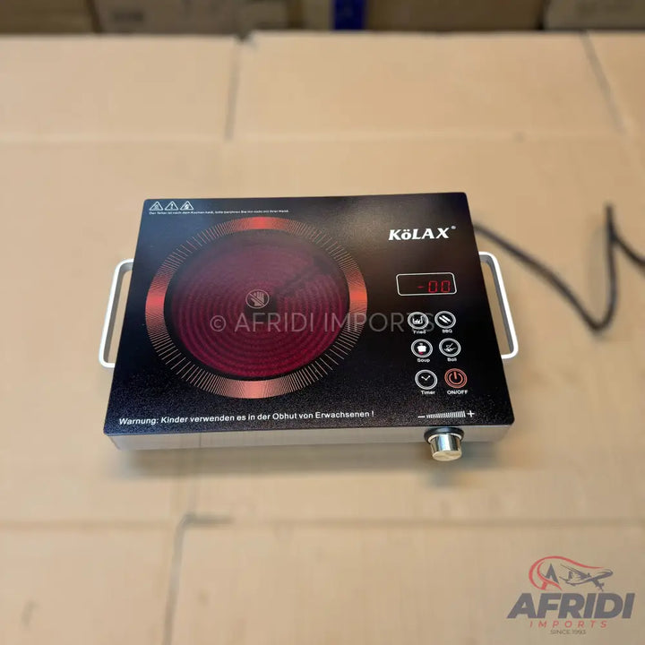 Black induction cooktop with a single red heating zone and digital controls.