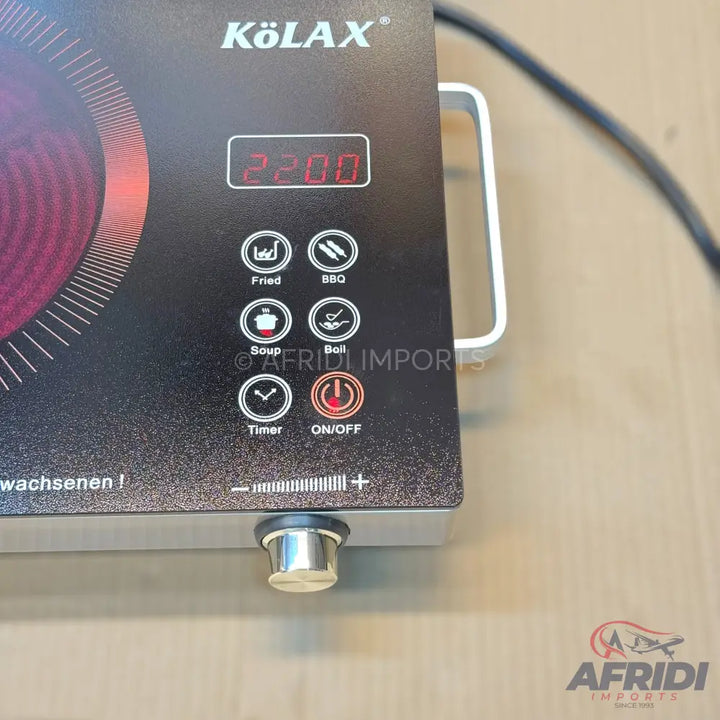 Black induction cooktop with digital display and touch controls.