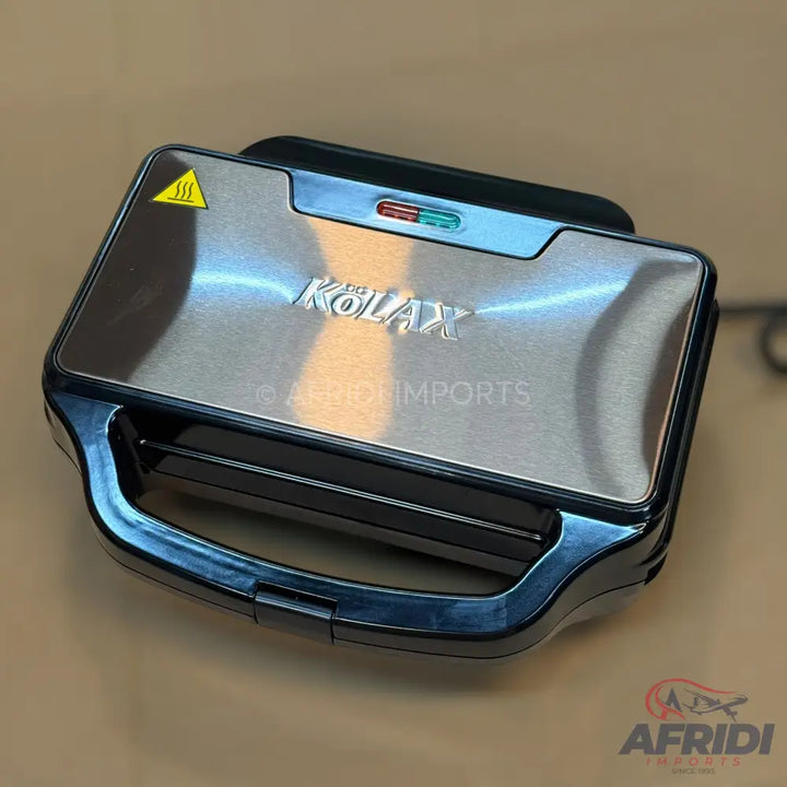 A brushed stainless steel sandwich maker with a black handle and indicator lights.