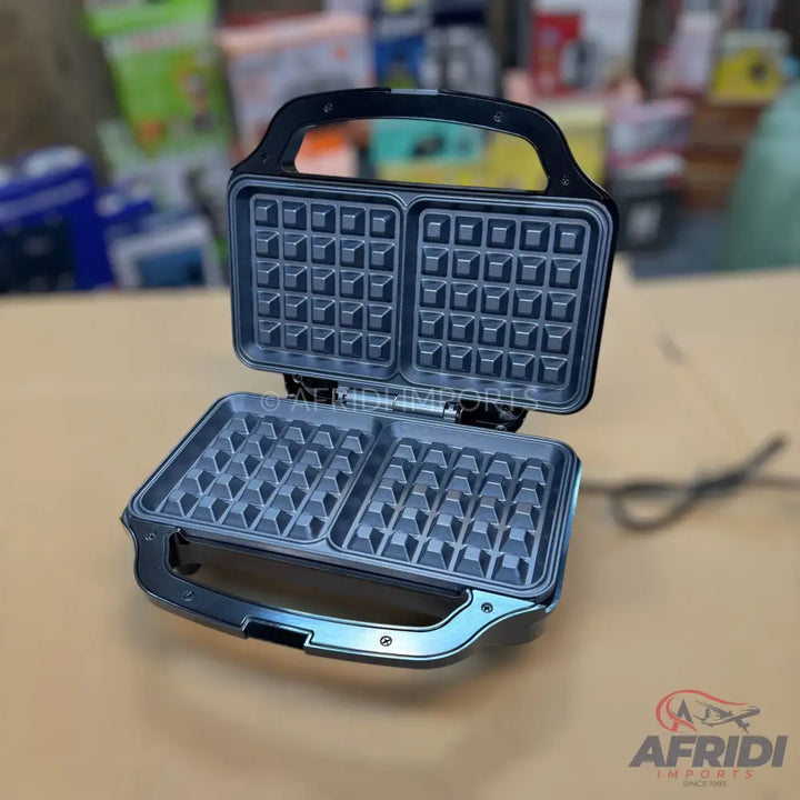 An open, black waffle maker with two square cooking plates.