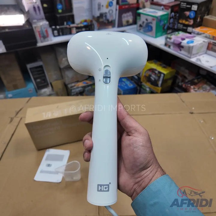 White handheld garment steamer with a two-button control on the handle.