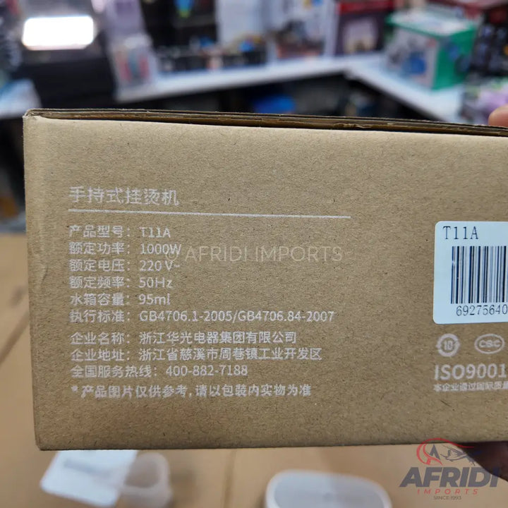 Cardboard box for a handheld garment steamer with specifications.