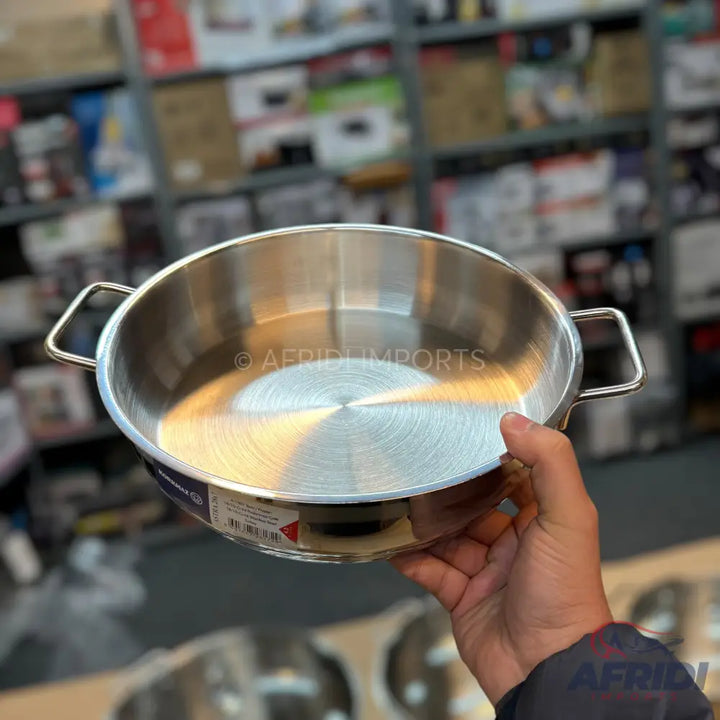 Stainless steel cooking pan with two handles.