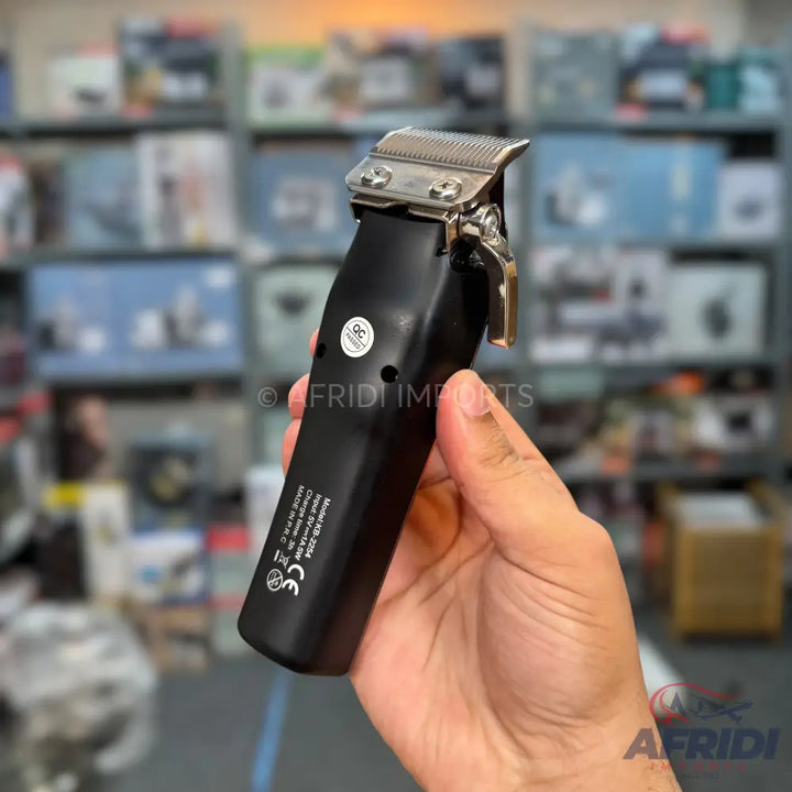 Black hair clipper with a silver blade and a metallic adjustment lever.