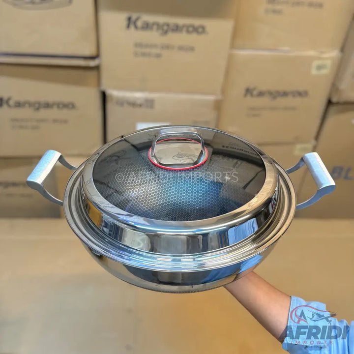 Stainless steel pot with a glass lid and two handles.