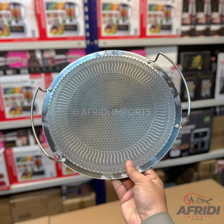 Round stainless steel mesh frying basket with two handles.