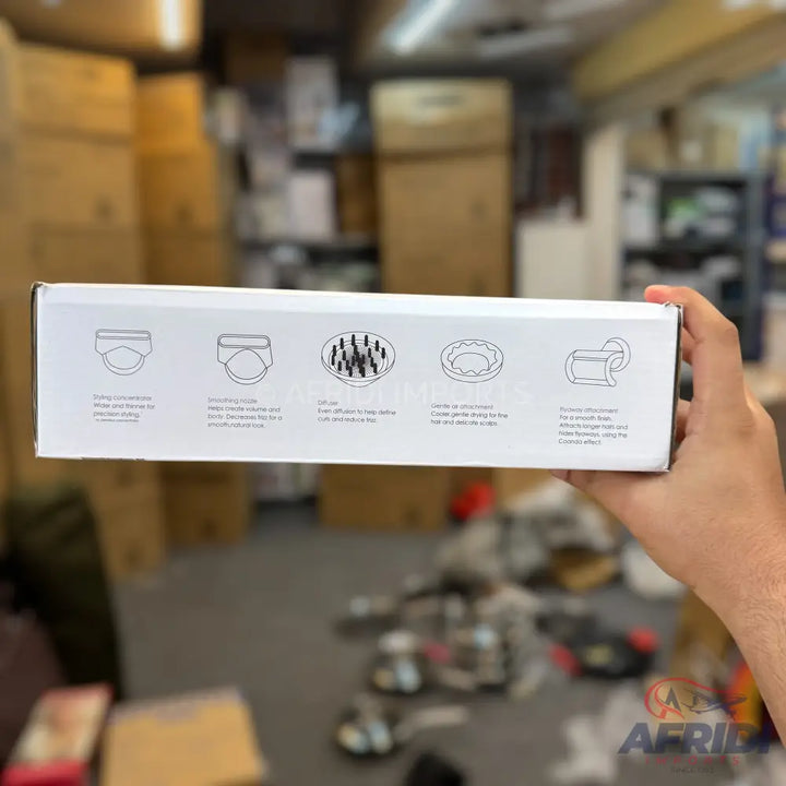 White box with diagrams and descriptions of hair styling attachments.