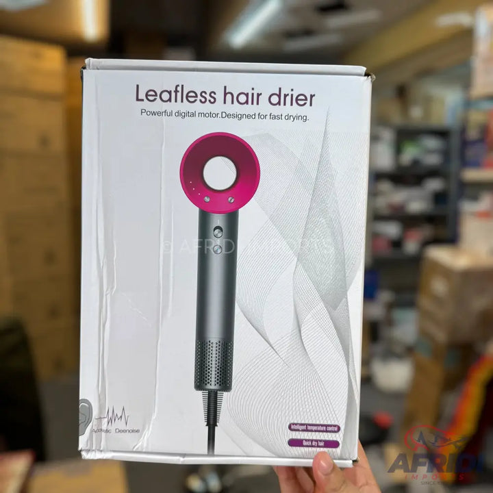 Box for a leafless hair dryer with a pink and gray design.