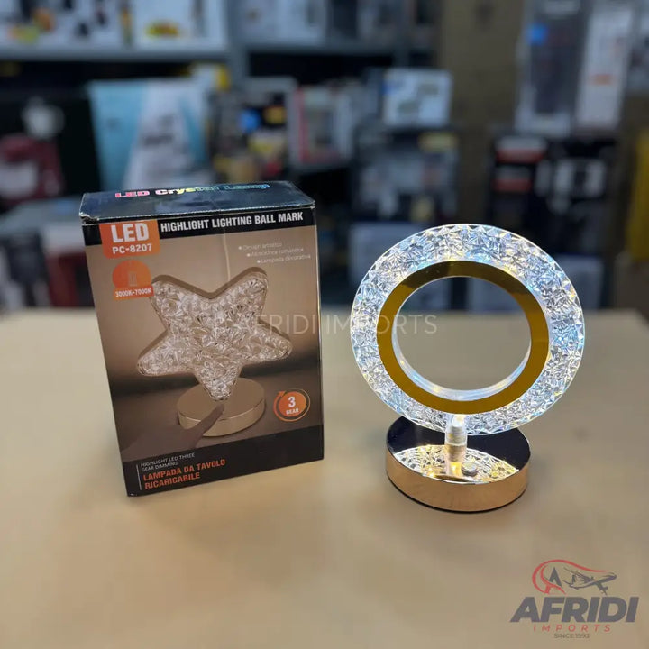 Two decorative LED lamps, one shaped like a star and the other a ring, both with a crystal-like appearance.
