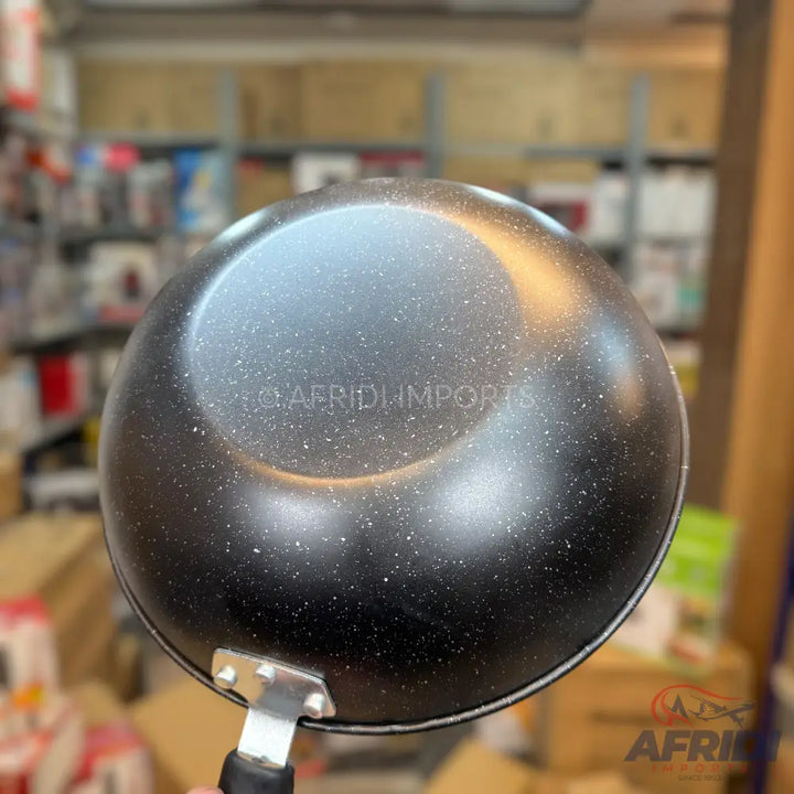 Black speckled non-stick frying pan with a handle