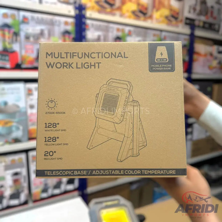 Box for a multifunctional work light with a telescopic base, adjustable color temperature, and mobile phone power bank function.