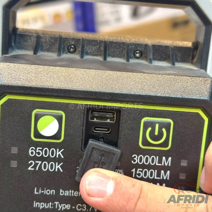 A portable, rechargeable work light with multiple light settings and a power bank function.