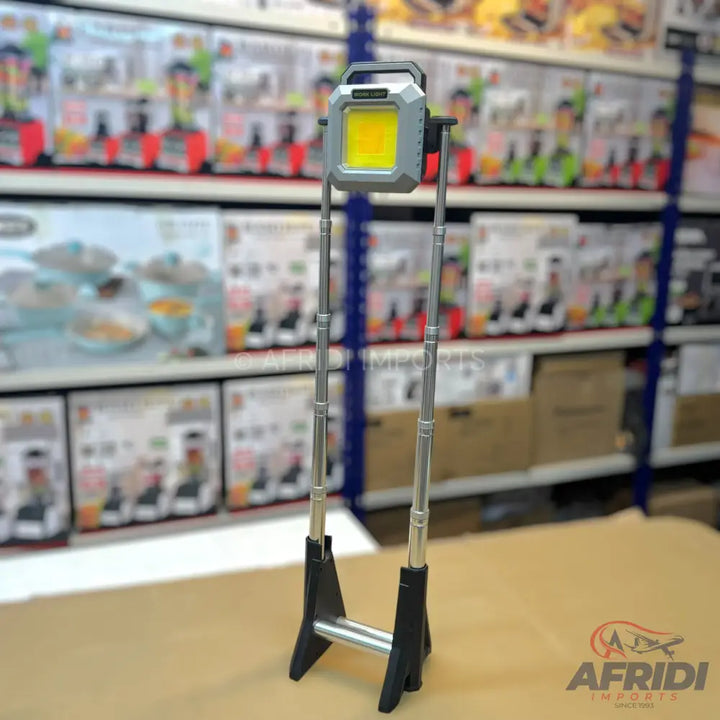 Extendable, portable LED work light with a stand.