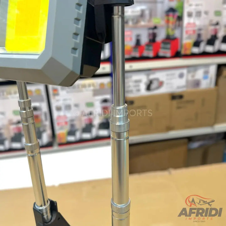 Adjustable portable work light with a bright yellow LED panel.