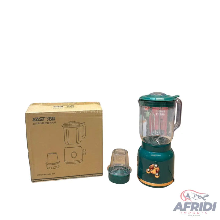 A green blender with a clear pitcher and an additional grinding cup, packaged with a box displaying a line drawing of the appliance.
