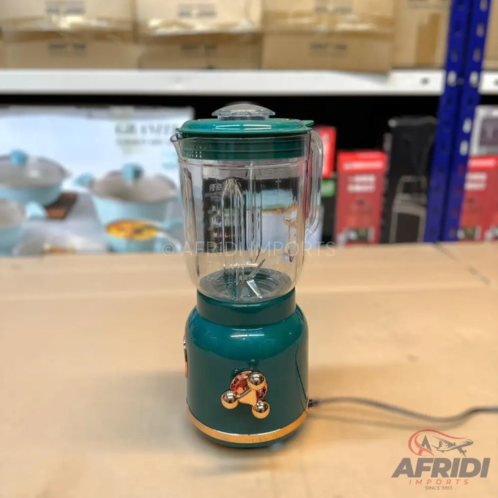 Teal and gold retro-style blender with a clear jar and matching lid.