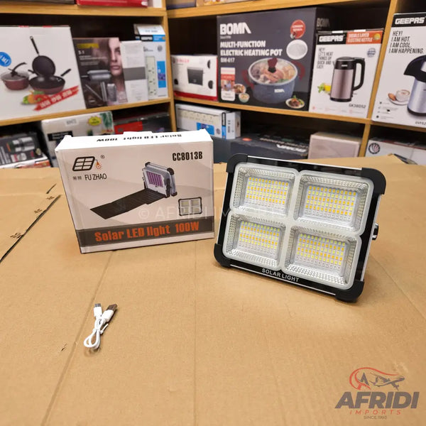 A solar-powered LED floodlight with four distinct light panels.