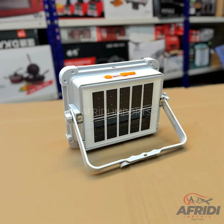 White solar-powered floodlight with an adjustable stand.