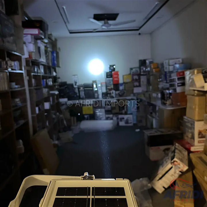 Solar-powered floodlight with an array of photovoltaic cells.