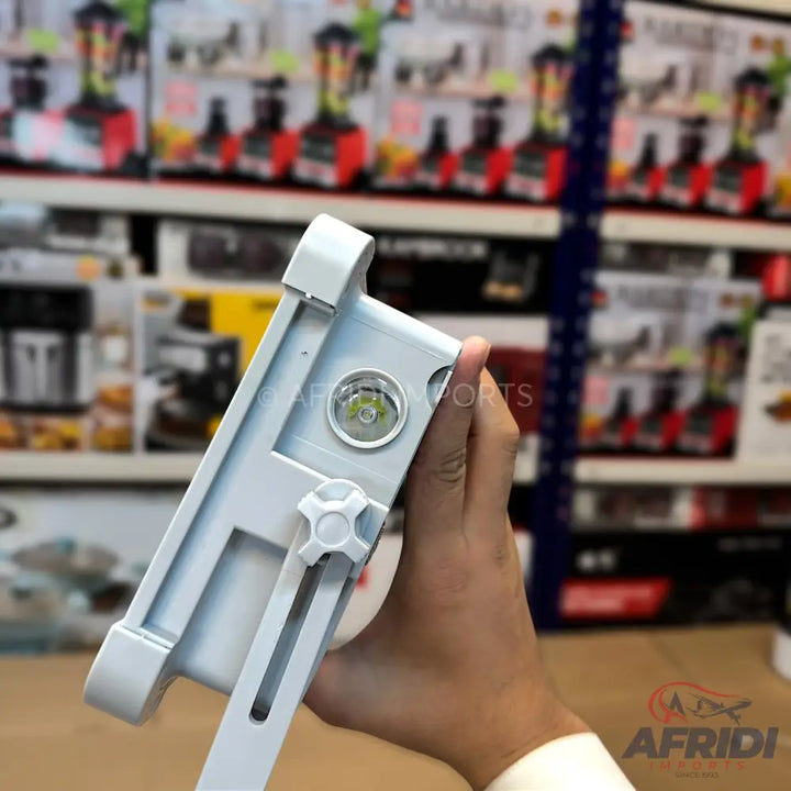 A white, adjustable LED floodlight with a single bright light source.