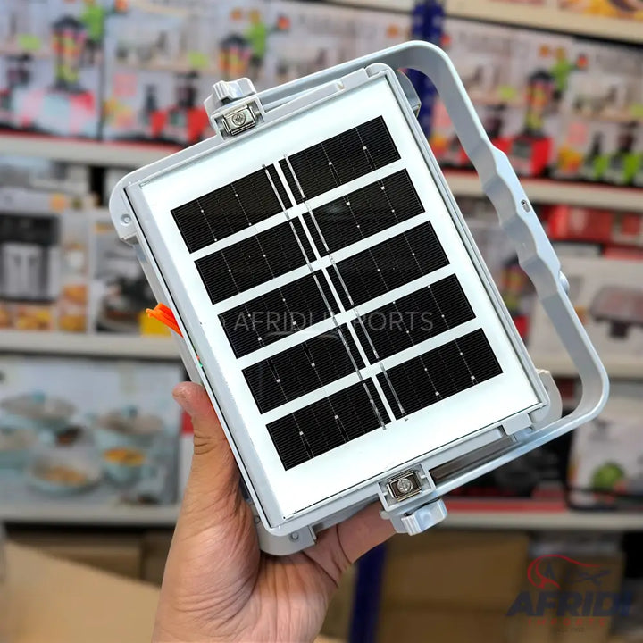A portable solar panel with an integrated light fixture.