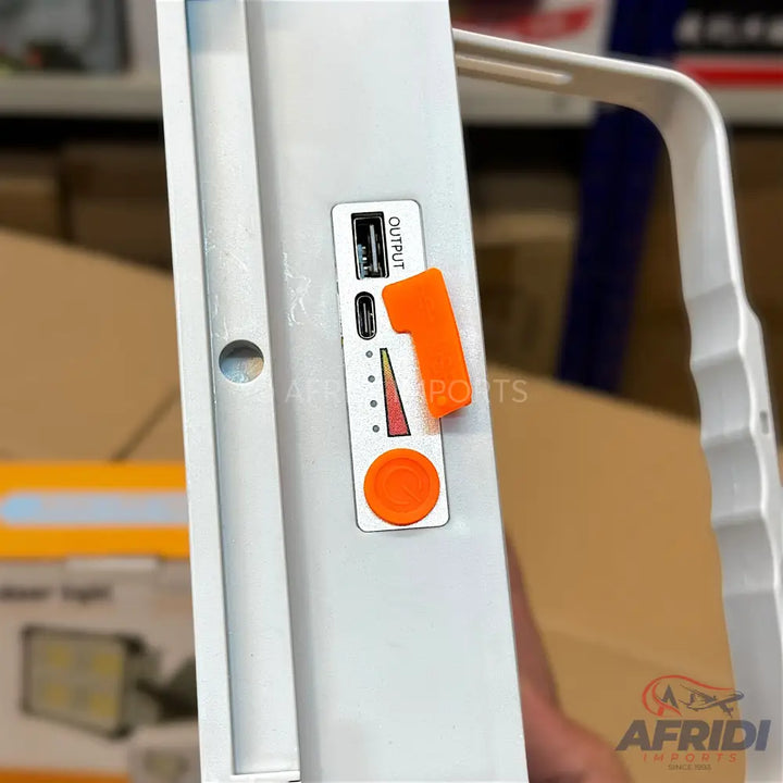 Portable white light with USB and USB-C output ports and a battery level indicator.