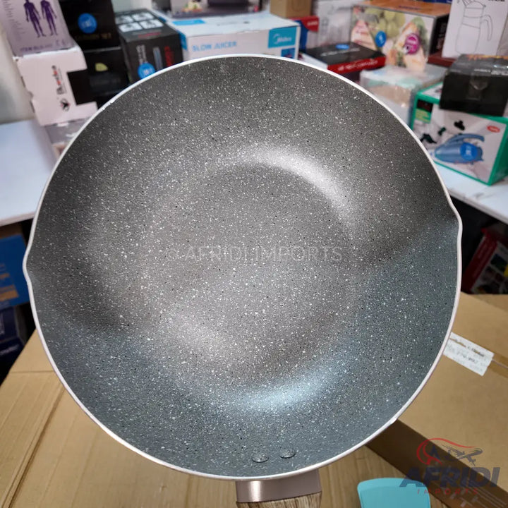 A non-stick granite speckled wok-style pan.