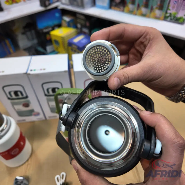 A thermos with a removable tea infuser lid.