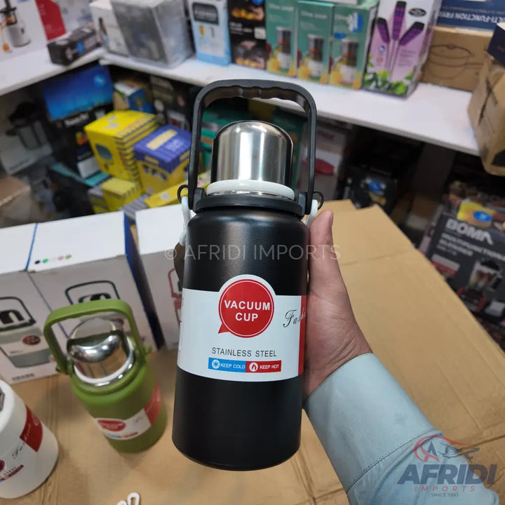 Black stainless steel vacuum cup with a handle.