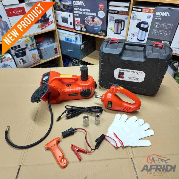 An orange electric car jack and impact wrench set with accessories, stored in a black carrying case.