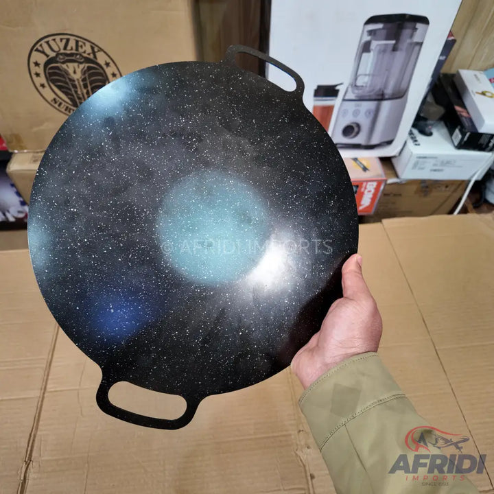 Black granite-coated flat tawa with two handles.