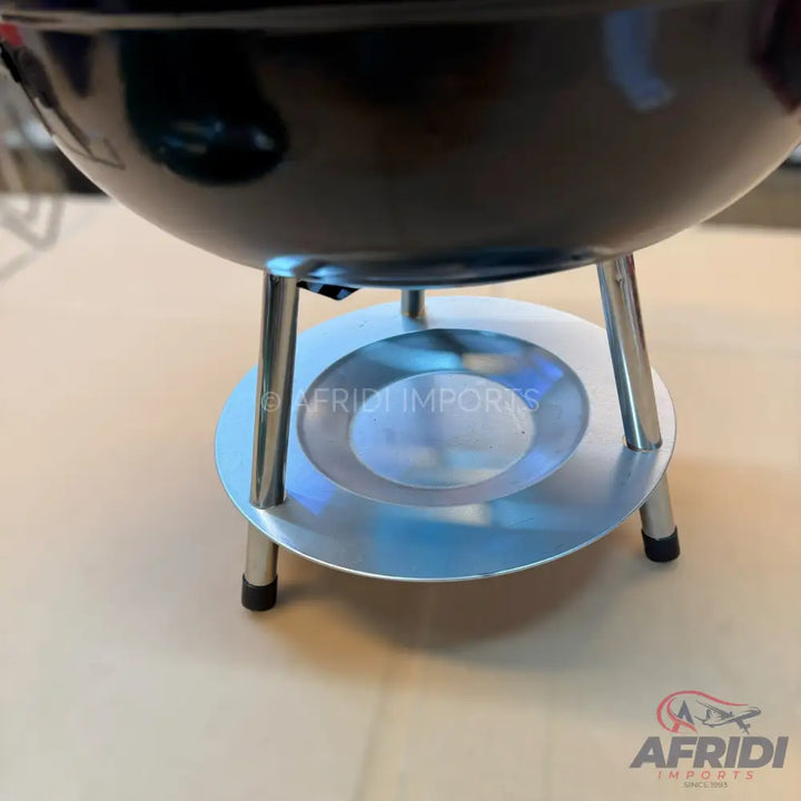 Black chafing dish with a silver-colored fuel holder.