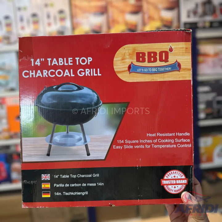 A 14-inch table-top charcoal grill with a heat-resistant handle, 154 square inches of cooking surface, and easy slide vents for temperature control.