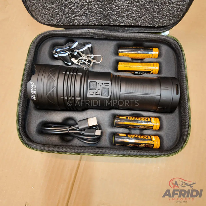 Black tactical flashlight kit with charging cable and multiple rechargeable batteries in a fitted carrying case.