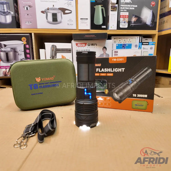 A black, heavy-duty flashlight with a digital display and an olive green carrying case.
