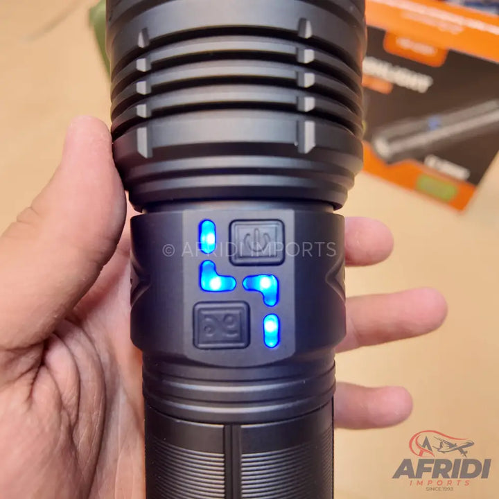 Black flashlight with blue indicator lights and two control buttons.