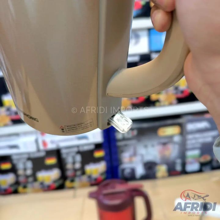 Beige electric kettle with a transparent power switch.