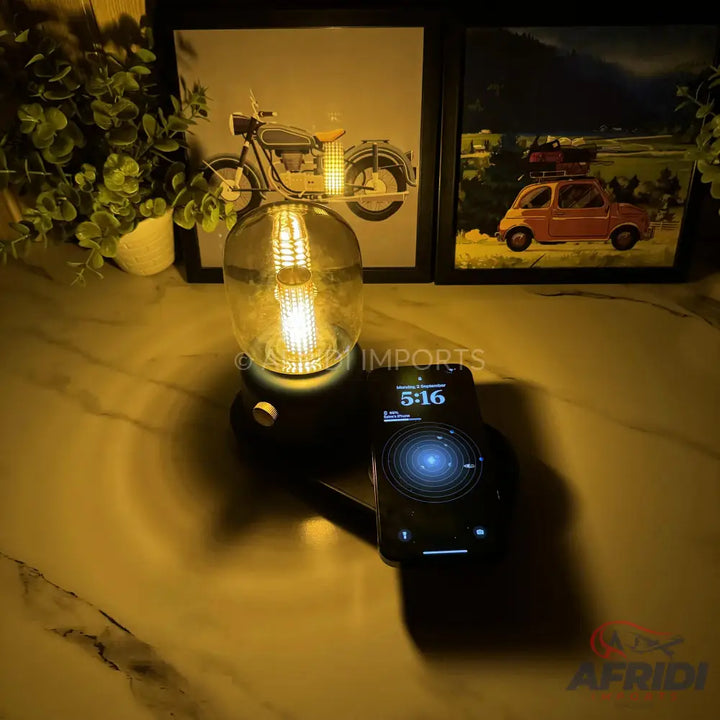 A wireless charging lamp with a clear, spherical bulb.